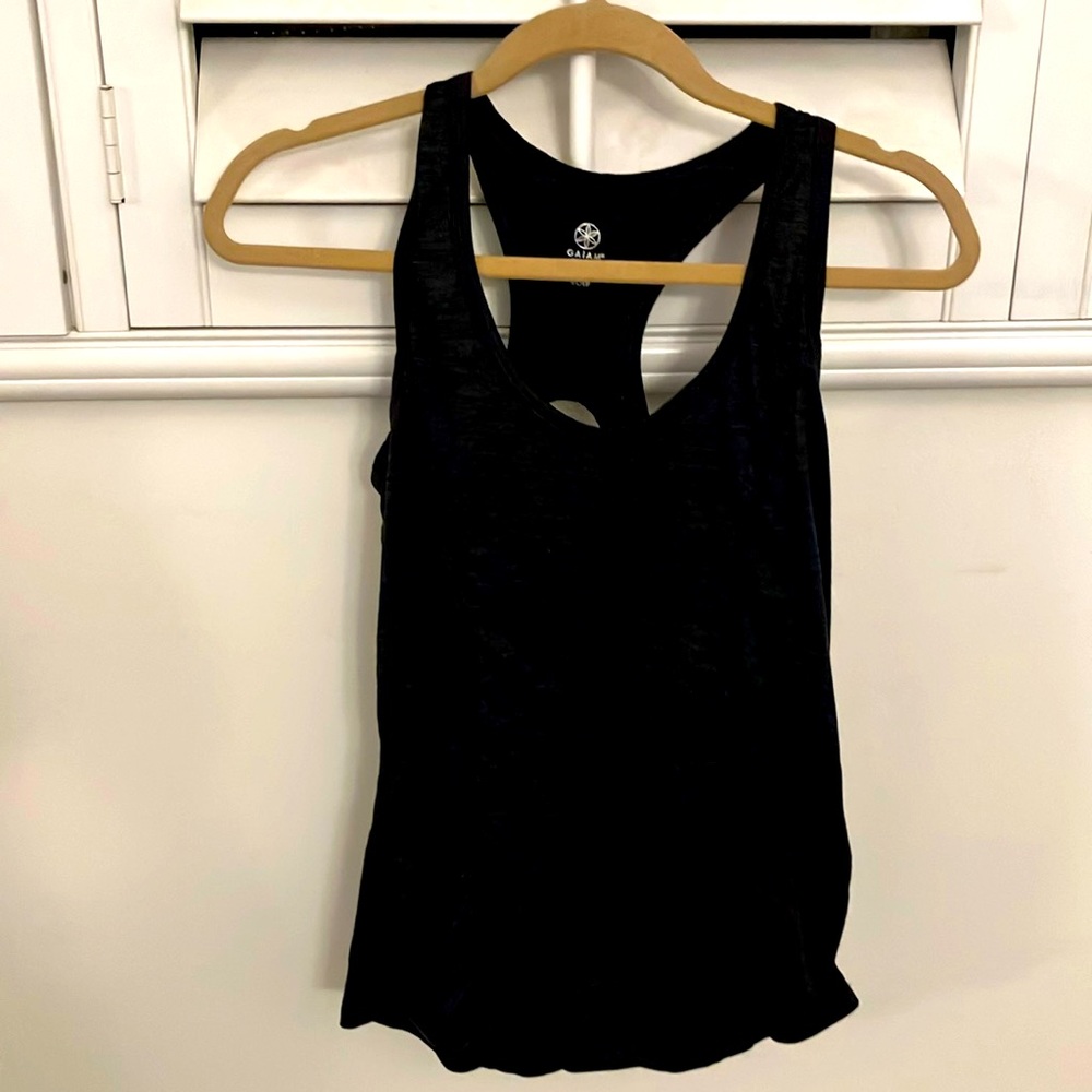 Super soft athletic tank top with racerback and rouching on front. Keyhole back